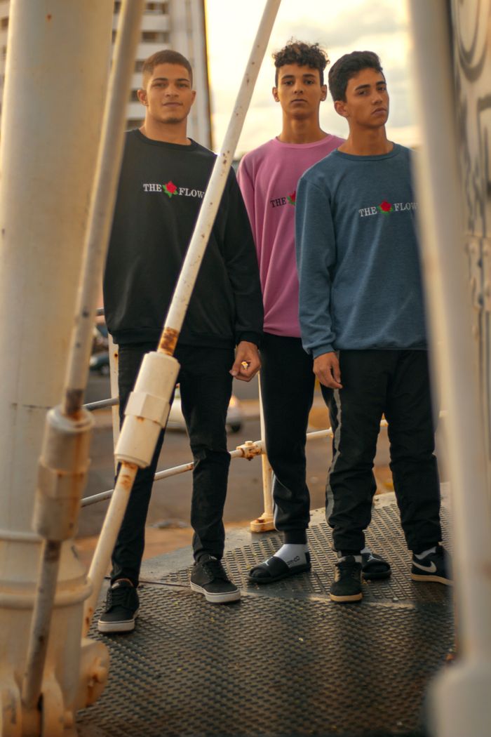 vision Three young men posing in trendy streetwear, showcasing casual urban style.